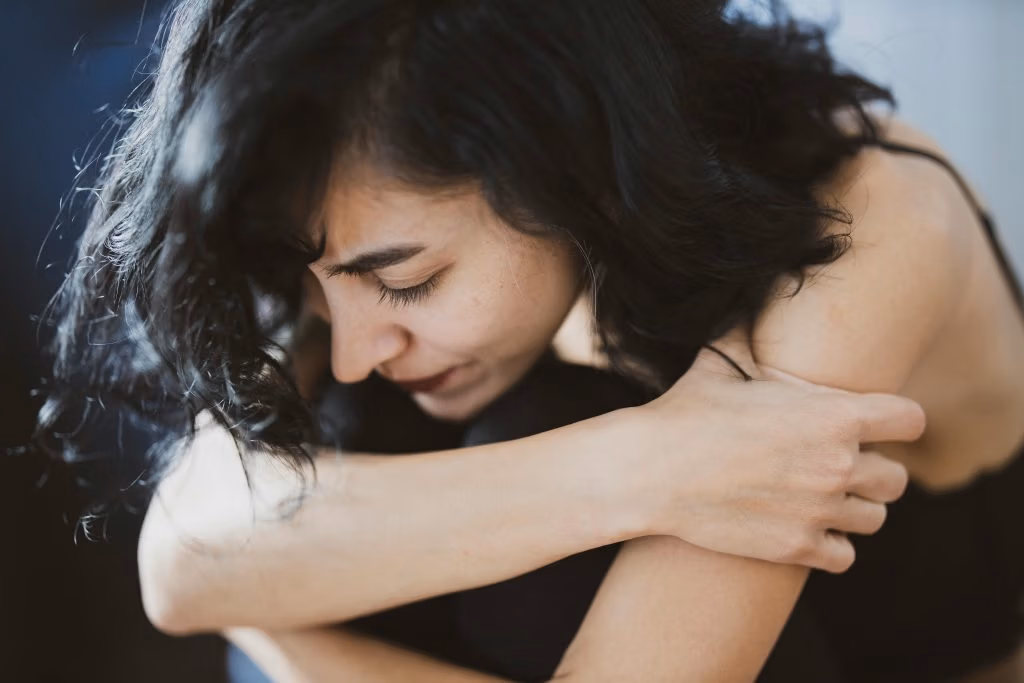 Woman in grief needing suicide loss healing in a support group